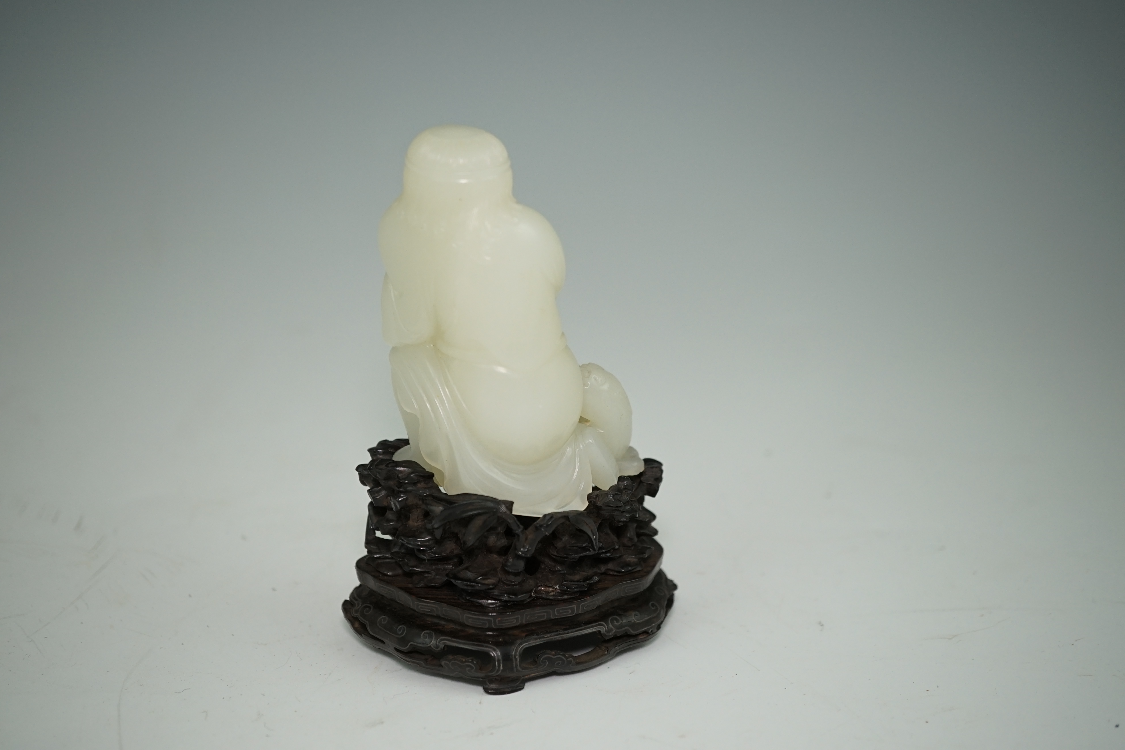 A fine Chinese white jade group of a bearded foreigner, 18th century